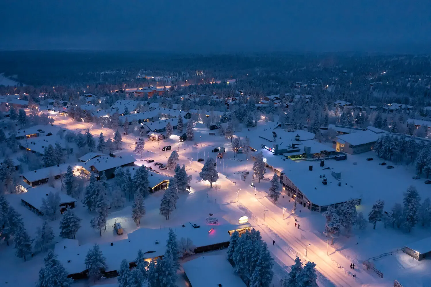 Aerial view of Saariselkä village blanketed in snow at night
