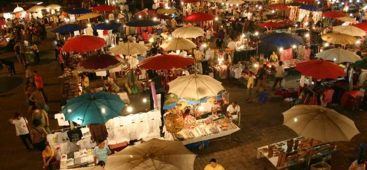 Colourful umbrellas shading the stalls of Chiang Mai Night Bazaar