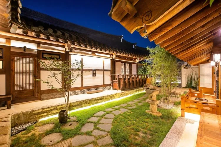 A lantern-lit hanok courtyard at night in Gyeongju